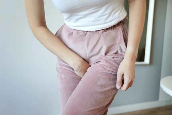 woman running for the toilet because of urinary incontinence Kington